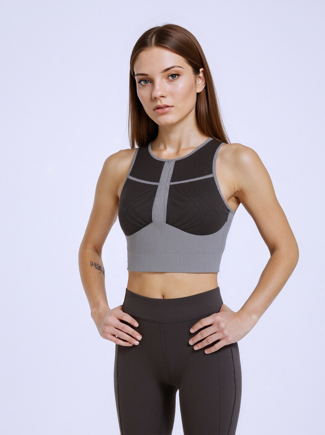 oNMexis model wearing black and gray geometric sports bra