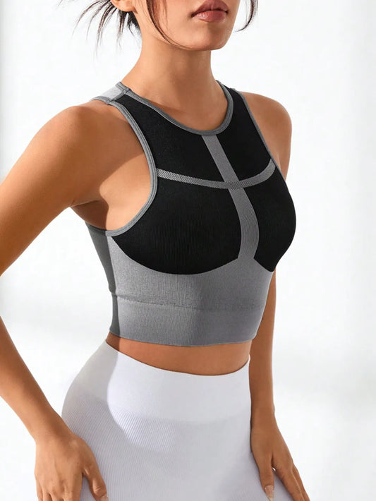 A female model front view of wearing color block tank top – round neck women’s workout tank with stretch fabric