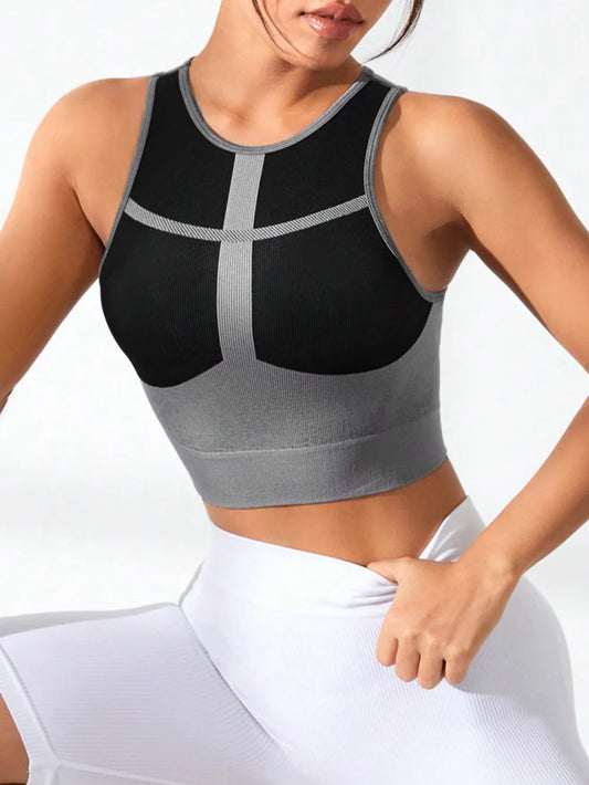 A female model wearing color block round neck active tank for women – breathable gym shirt with sleeveless design