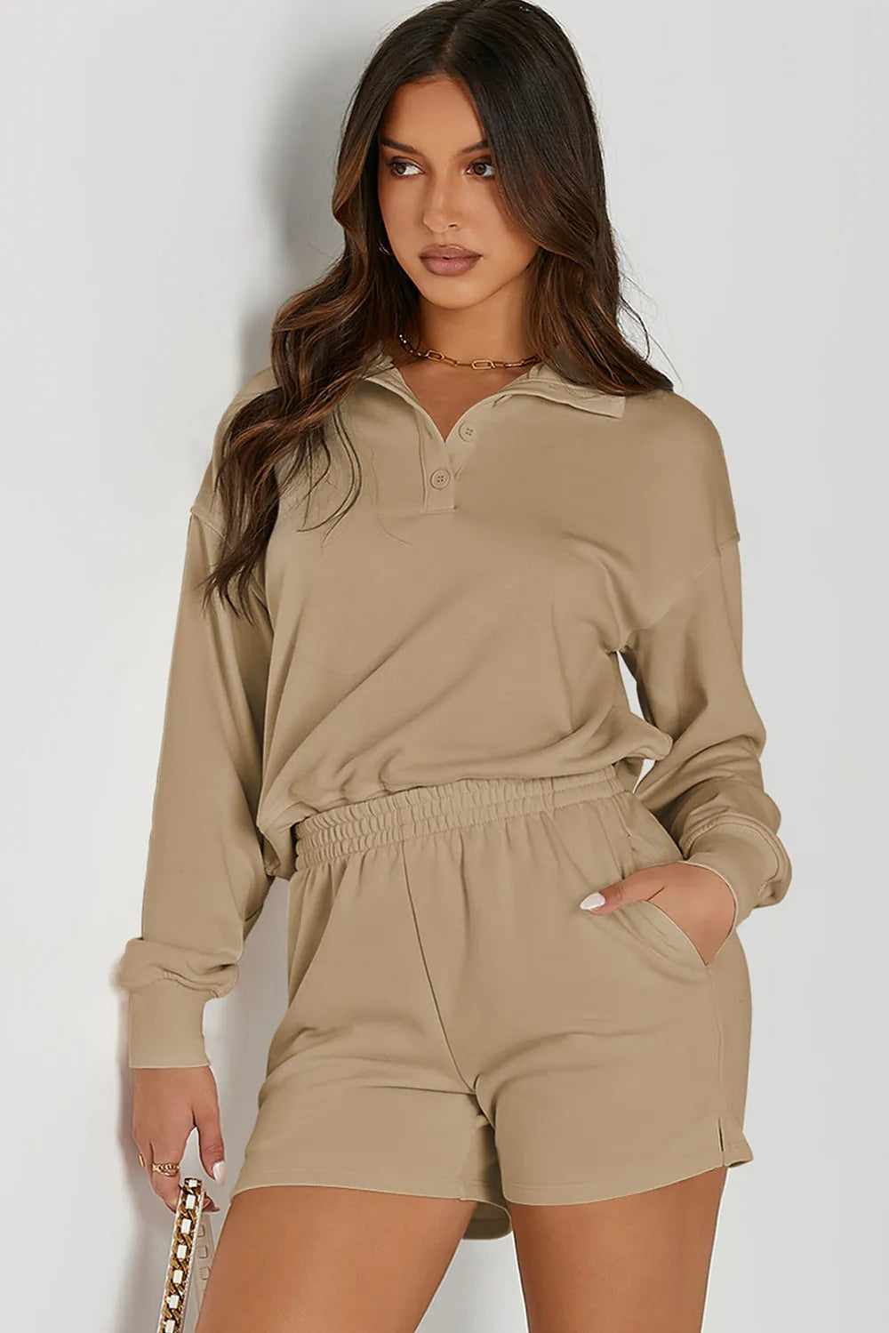 oNMexis female model wearing a half-button tan sweatshirt and shorts activewear set – casual workout outfit in soft fabric