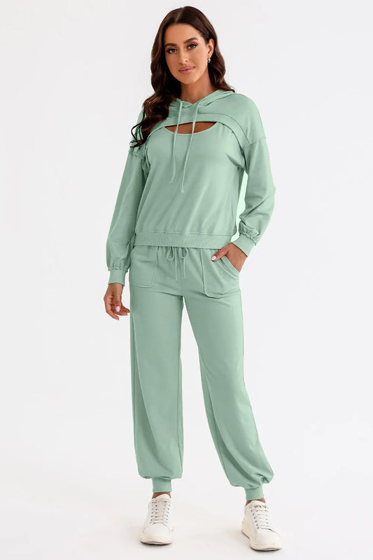 Woman wearing a mint green tracksuit