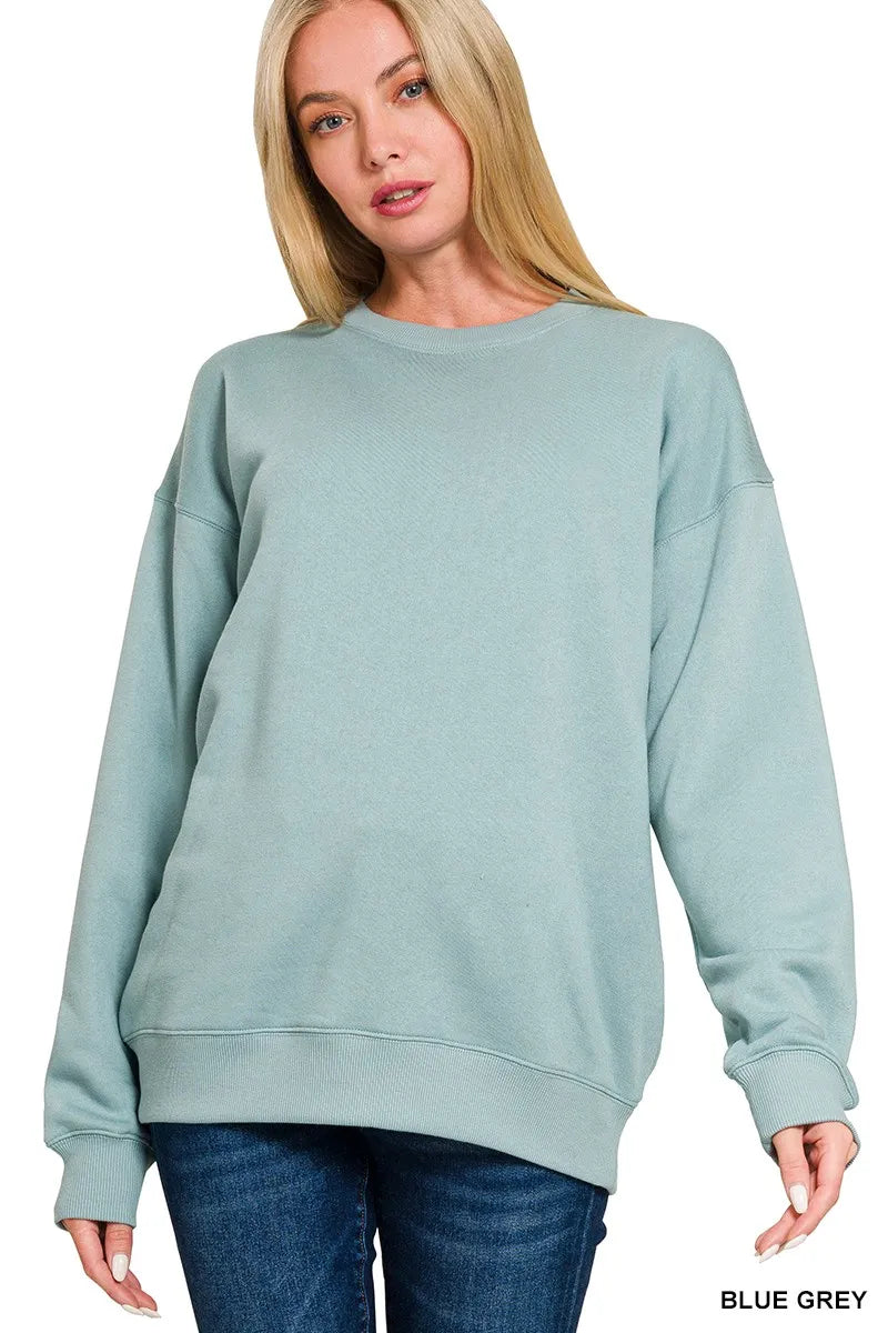 Woman wearing a blue-grey sweatshirt