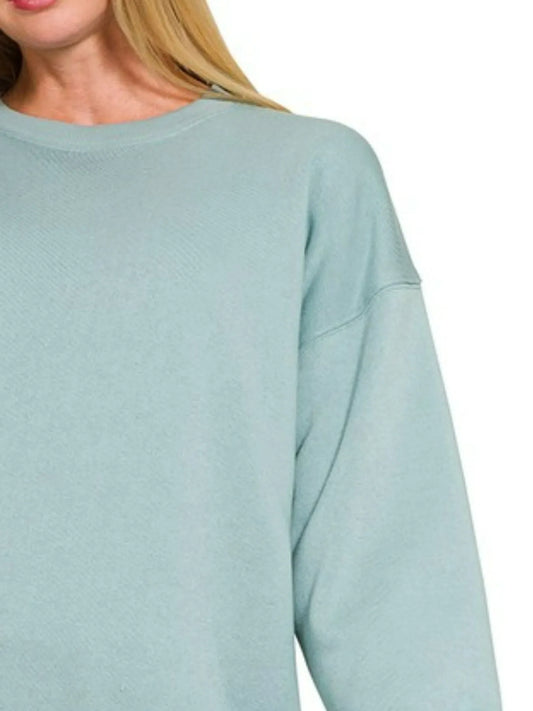 Light blue sweatshirt with dropped shoulders