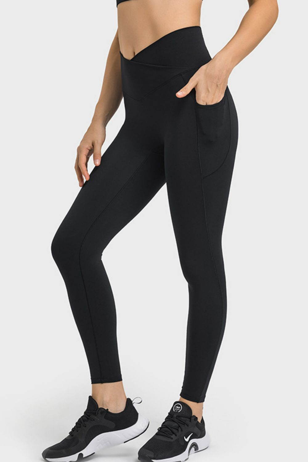 Onmexis model wearing black leggings on a white background